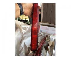 PAIR 90S CADILLAC DEVILLE TAIL LIGHT ASSEMBLIES AND BEZELS