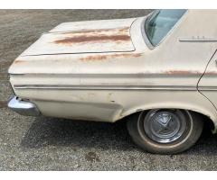 Set of Hubcaps on 63 Plymouth